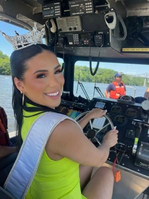 Miss New York Steering the Coast Guard Vessel During the Boat Parade Flotilla