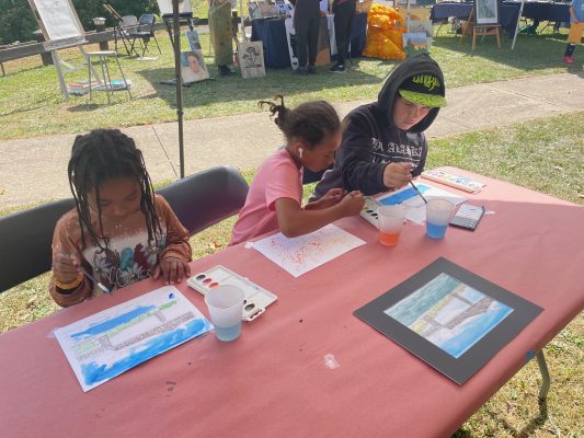 Children enjoying painting at the Skywalk Arts Festival